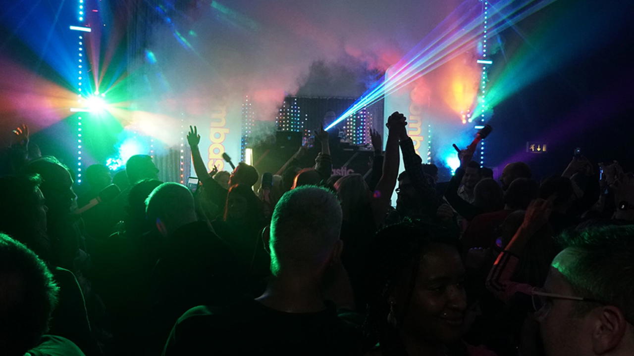 Crowd and stage lights at a Boombastic event